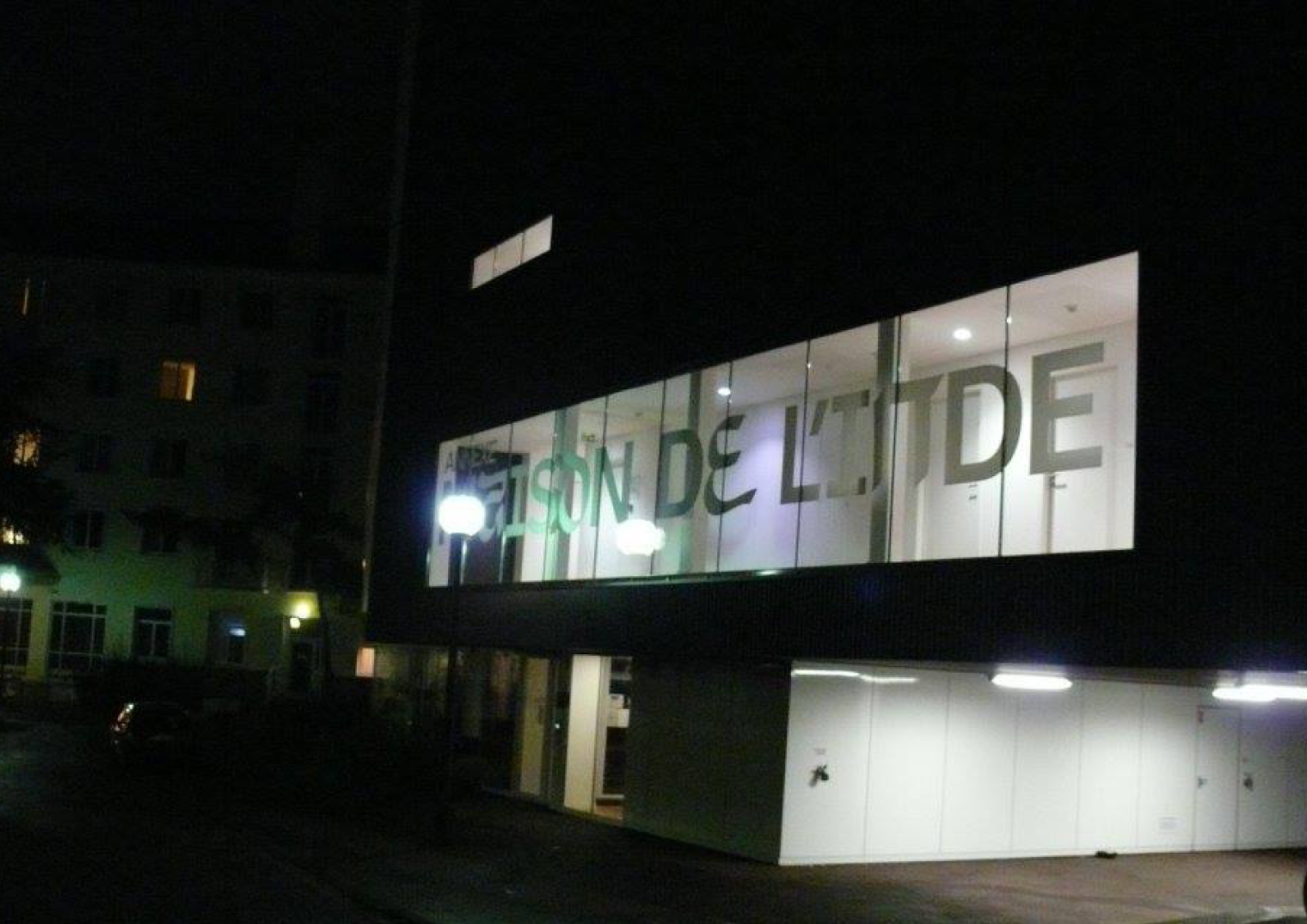 Glazed façade at night.