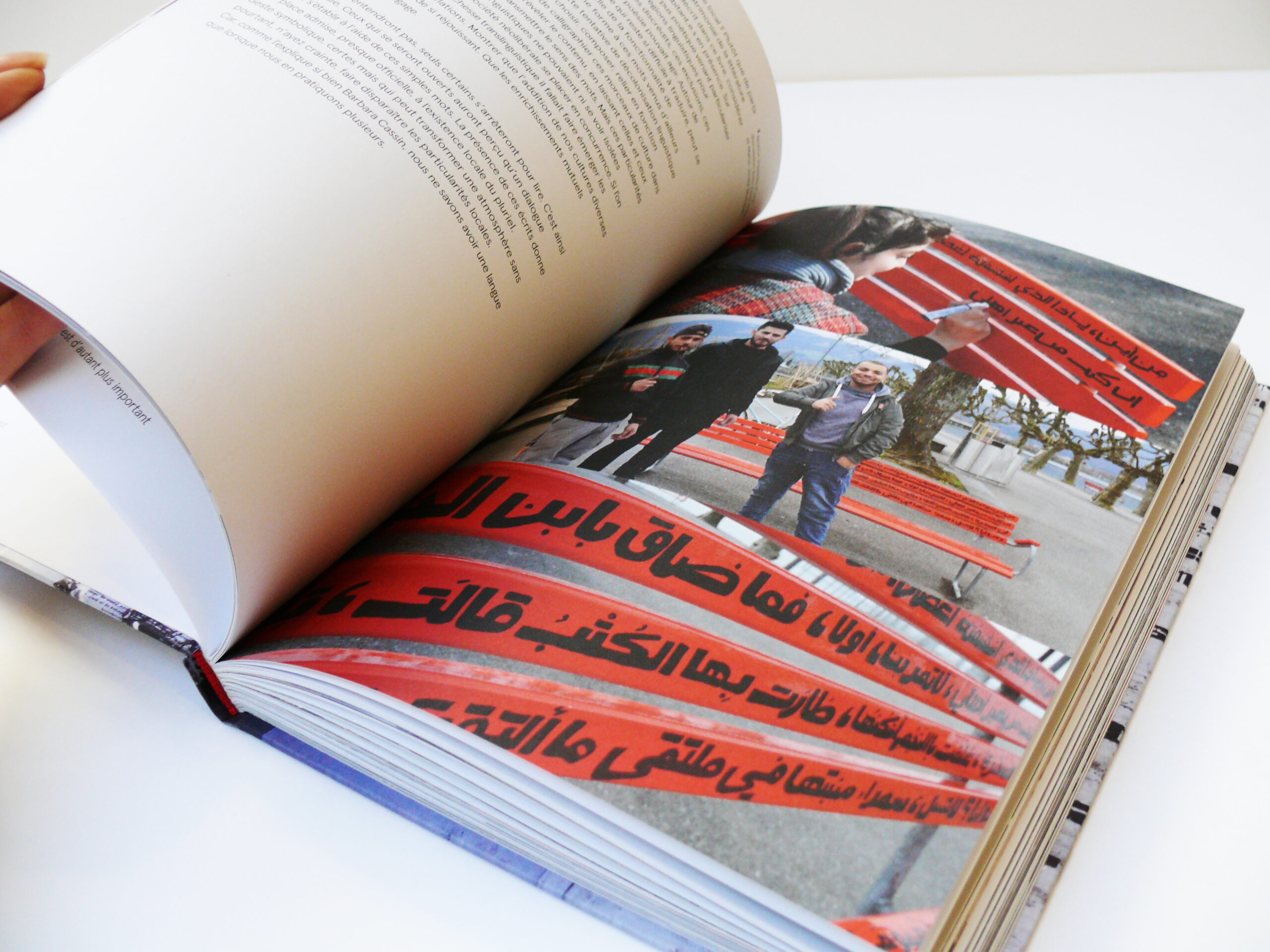 Book open at a photograph of a bench.
