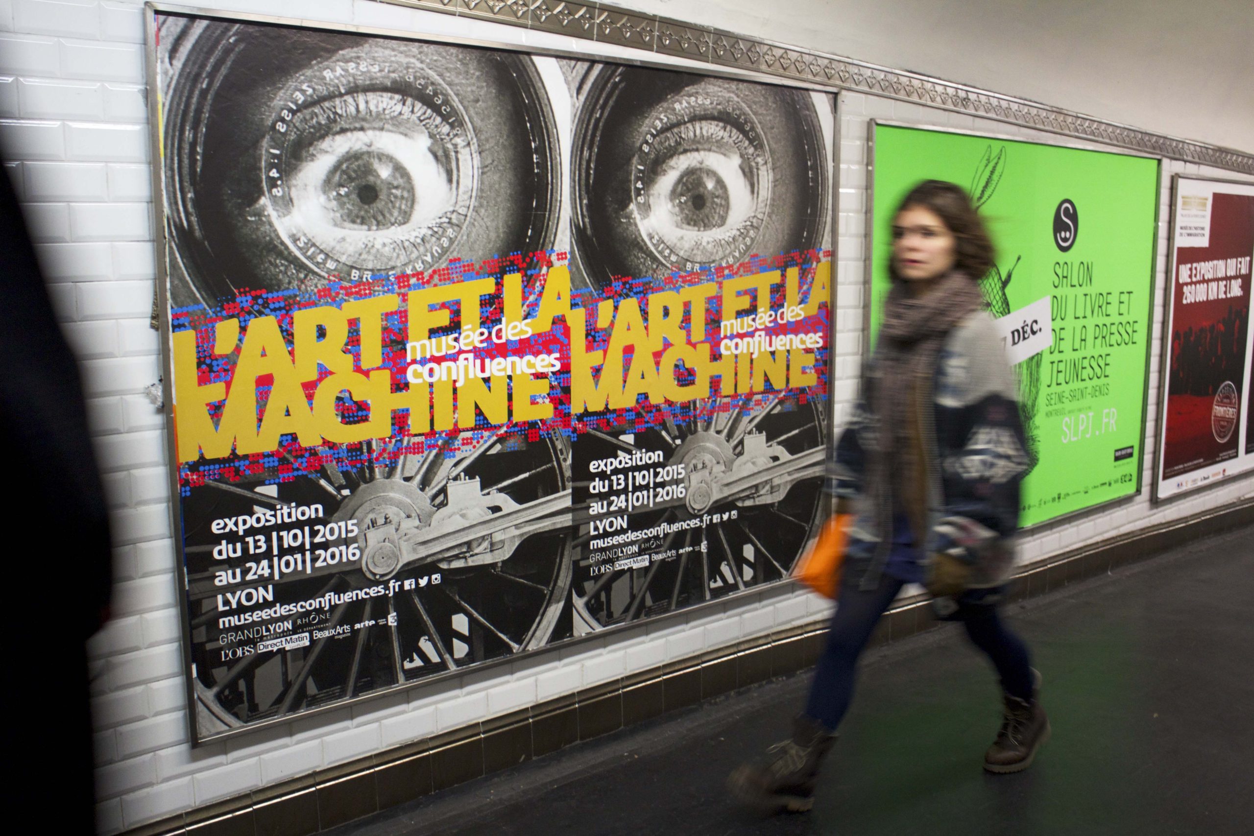 Poster and person in the underground.