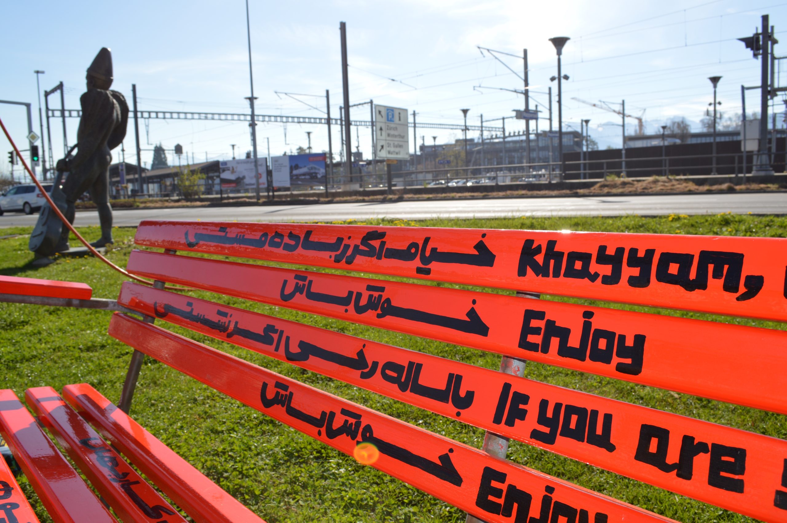 Detail of the bench and multilingual lettering.