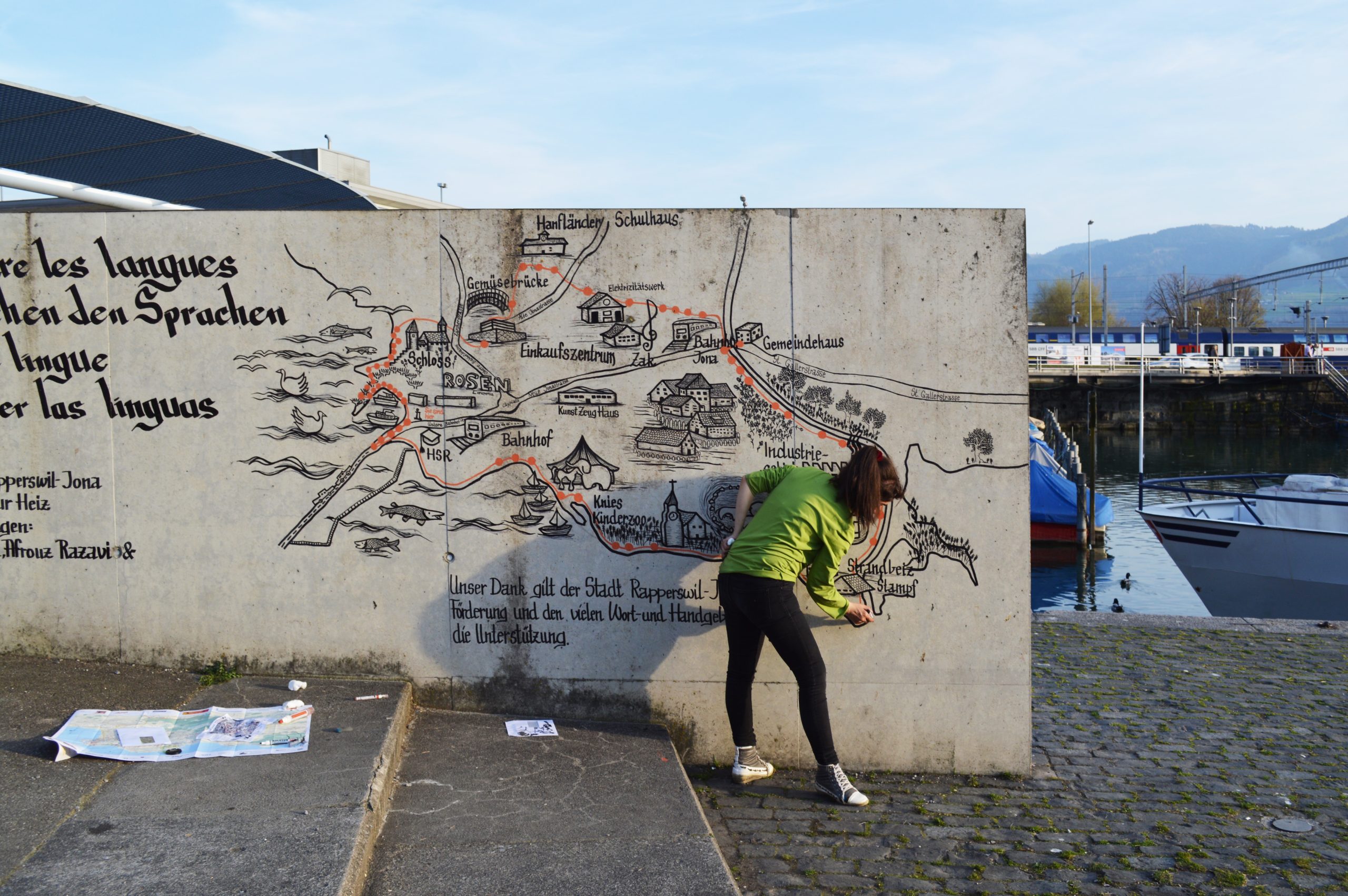 Drawn map and lettering on a wall.