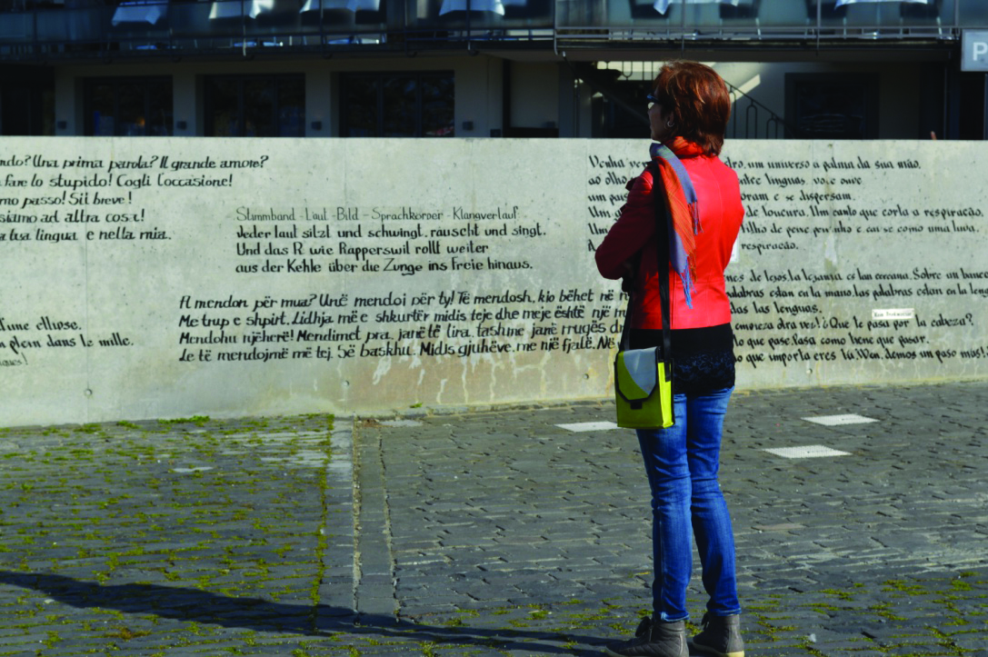 Person facing wall lettering.